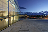 View from the illuminated Opera House during the blue hour in Oslo, Norway.