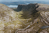 Scenic aerial view winding road through rugged mountain landscape, Bealach na Ba, Scotland