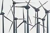 Wind turbines against sunny blue sky