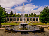 Fountain and foyer in the spa park with a view of the St. Trinity Church in the city center, Bad Elster, Vogtland, Saxony, Germany