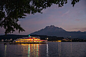 Illuminated passenger ship on Lake Lucerne