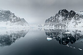 Antarctica, Antarctic Peninsula, Lemaire Channel. Mountain reflection.