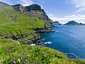 Coast Near Gasadalur. Island Vagar, Part Of The Faroe Islands In The North Atlantic. Denmark