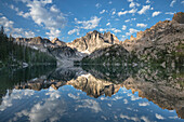 Monte Verita Peak mirrored in still waters of Baron Lake, Sawtooth Mountains Wilderness, Idaho.