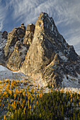 Liberty Bell Mountain Early Winters Spires, and golden autumn Larches. Seen from Washington State Pass Overlook. North Cascades, Washington State