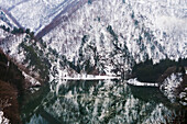 Reflection of mountain covered with snow in the lake, Gifu Prefecture, Japan
