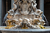 Italy, Rome. Piazza della Rotunda, Fontana del Pantheon, 1575, (supplied by Virgo (Vergine) Aqueduct, carved marble masks and dolphins