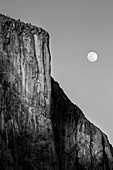 USA, California, Yosemite National Park, Full moon rising near El Capitan at sunset