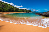 Sand and surf at Lumahai Beach, Island of Kauai, Hawaii