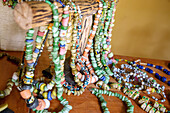 Strings of glass beads made from glass bottle waste at the Cooperativa de Valorização de Resíduos in the village of Roça Porto Real on the island of Príncipe in West Africa