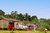 island-style wooden houses with washing lines in the village of Terreiro Velho on the island of Príncipe in West Africa