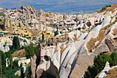 Turkey, Central Anatolia, Nevsehir Province, Goreme National Park, UNESCO World Heritage site, Uchisar village and Pidgeon Valley rock cut dwellings, some abandoned.