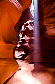 Page, Arizona. Upper Antelope Canyon. Ray of light streams down from the open slot of Upper Antelope Canyon