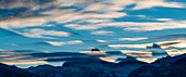 crepuscular Shadows cast by Teton Peaks before Sunrise. Altocumulus lenticularis clouds are also visible.