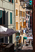 A narrow alley leading to the beach, Boccadasse, Genoa, Liguria, Italy.