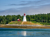 USA, Maine, Lubec. Mulholland Point Lighthouse as seen from the town of Lubec, Maine.
