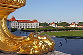 Foot of one of the golden lamps of the staircase at the entrance to the city side of Nymphenburg Palace, Nymphenburg, Munich, Upper Bavaria, Bavaria, Germany