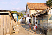 Alleyway with children in the plantation village of Roça Ponta Figo on the Rota do Cacau on the island of São Tomé in West Africa