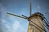 Windmill of Kindedijk in the Netherlands with the blue sky in the background