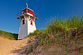 Canada, Prince Edward Island, Prince Edward Island National Park. Lighthouse and dunes at Covehead Harbour