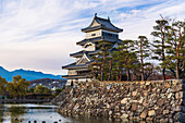 Closeup of the Matsumoto Castle in the golden light of the evening sun, Japan