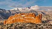 USA, Colorado, Garden of the Gods. Fresh snow on Pikes Peak and sandstone formation