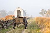 Walla Walla, Washington State. USA. Historic replica wagon along the Oregon Trail at Whitman Mission National Historic Site.