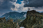 Male climber on ridge, Absaroka Mountains near Cody and Meeteetse, Wyoming, USA, Washakie Wilderness.