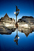 Double exposure of a statue of Saint Michael slaying the dragon in Ghent, Belgium.