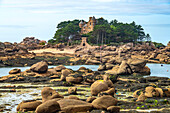 The rocks of the pink granite coast Côte de Granit Rose at Ploumanac'h and the Costaérès Castle, Perros-Guirec, Brittany, France