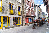 Horse carriage in the old town of Josselin, Brittany, France