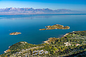 View over Lake Skadar with the island of Beška near the village of Donji Murici, Montenegro, Europe