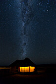 Africa, Namibia, Namib-Naukluft Park. Milky Way over lodge hut
