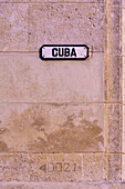 Cuba street sign on pink wall in Old Havana, La Habana Vieja, Cuba