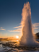 The geysir Strokkur in the geothermal area Haukadalur part of the touristic route Golden Circle during winter. Iceland ()