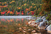 USA, Maine, Acadia National Park, Fall reflections with fog at Jordon pond.