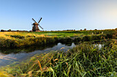 windmill, water mill. Neustadt-Gödens, Friesland, Lower Saxony, Germany. small canal.