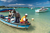 fisherman in their boat, Grand Baie, Mauritius, Africa