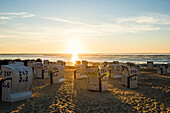 Beach chairs, sunset, Duhnen, Cuxhaven, North Sea, Lower Saxony, Germany