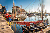 Historic sailing boats in Honfleur harbor in the morning light, Calvados, Normandy, France