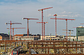Construction cranes at Copenhagen train station, Denmark, Europe
