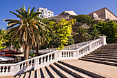 View of Parc Rochina with white stairs and palm trees going up to Plaza Espanya and Mercat Des Claustre, Mahon, Menorca Island, Balearic Islands, Spain