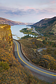 The Columbia River Highway from Rowena Crest, view of a road and lake.