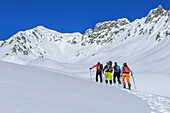 Four people on a ski tour ascending to the Kellerjoch, Kellerjoch, Zillertal, Hochfügen, Tux Alps, Tyrol, Austria