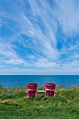 Canada, Labrador, Newfoundland, Coastal Trail, Two pink?adirondack?chair on coastal trail in?Gros?Morne?National Park