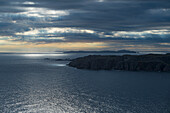 Canada, Labrador, Newfoundland, Twillingate, Dramatic seascape view on cloudy sunrise