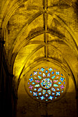 Spain, Seville, Multicolored rose window in Cathedral