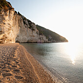 Italy, Apulia, Gargano, Baia Delle Zagare, Cliff and beach on coast of Adriatic Sea