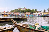 Fishing port in Elmina looking towards the Fortress of São Jago da Mina in the Central Region of western Ghana in West Africa