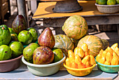 Street sale of mangoes, melons, avocado and jackfruit in Winneba in the Central Region of western Ghana in West Africa